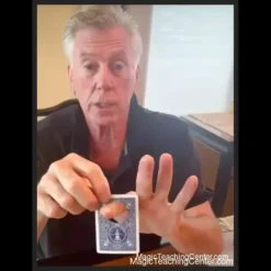 Cary Jaymes Holey card magic tutorial: A hand presenting a playing card with a magically appearing hole.