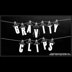 Greg Van Holsbeck performing Gravity Clips magic trick, showcasing a chosen card suspended on a cord while others fall, demonstrating the visual mind-reading effect.