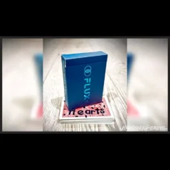 Close-up image depicting a Sharpie writing on the back of a playing card, with the ink visually morphing into the name of a selected card, showcasing the Roddy McGhie and Noel Qualter Flux 2.0 magic trick effect.