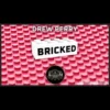 Drew Perry's Bricked LEGO card magic: Custom playing card visibly transforming into plastic bricks, alongside a brick-built deck.