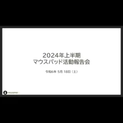 Still image from the Mousepad 2023 Japanese Card and Coin Magic Tutorial video, showing a magician's hands performing a close-up illusion with cards and coins.