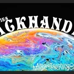 David Davis demonstrating the Backhanded Knothole Cut card flourish, showing precise card handling during the magic trick tutorial.