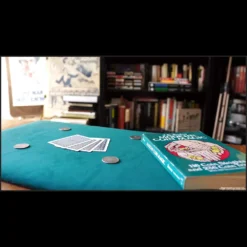 Magia Estudio video course cover showcasing a close-up magic mat with coins, illustrating the Matrix and Sympathetic Coin effects.