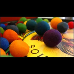 Close-up of a magician's hand performing a sponge ball magic trick, demonstrating a technique from the Magia Estudio Sponge Magic video course.