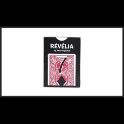 A magician's hand holding a clear, solid block engraved with a card value or character, illustrating the visual transformation effect from Axel Vergnaud's Révélia magic trick video.