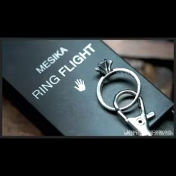 Yigal Mesika demonstrating the Mesika Ring Flight magic trick, showing a borrowed ring appearing on a set of keys with the stealth car key gimmick.