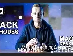 Jack Rhodes teaching close-up magic techniques in his Magic Desktop Lecture video, featuring a magician's hands with playing cards and coins.