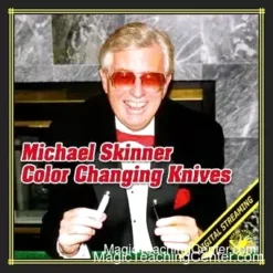Michael Skinner performing his Color Changing Knives magic trick routine, showing two knives transforming colors in his hands for a close-up audience.