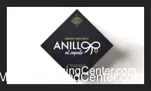 Adrián Carratalá's Ring to Shoelace magic trick showcasing a gold ring impossibly tied to a black shoelace on a dark shoe, highlighting the vanishing ring illusion gimmick in action.