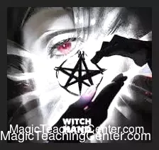 Kenton Knepper demonstrating 'Witch Hand' magic trick, showing a silver pentagram or coin in one hand, illustrating the 'Guess Which Hand It's In' mentalism effect.