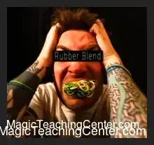 Dr. Cyril Thomas demonstrating a visually stunning rubber band penetration effect, showcasing the impromptu magic taught in the Rubber Blend masterclass.