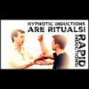 James Tripp demonstrating a rapid hypnosis induction technique during his 'Rapid Induction Rituals' workshop, with an attentive subject and audience.