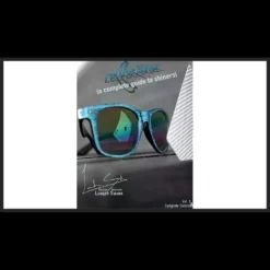 Landon Swank demonstrating the shiner card technique from his 'Reflections' magic tutorial, with playing cards visible.