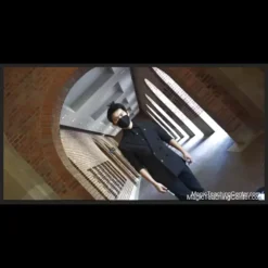 Jeffrey Wang demonstrating a complex coin magic sleight, with a coin appearing to vanish or manipulate expertly in his hands, illustrating the 'Heat the Coin' tutorial.