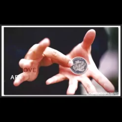 Close-up of a magician's hands demonstrating the final stages of a coin retention vanish, with a silver coin seemingly disappearing.
