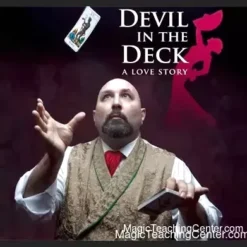 Paul Nathan performs 'Devil in the Deck' live, showcasing intricate card magic on stage with theatrical lighting and an overhead camera capturing the action.