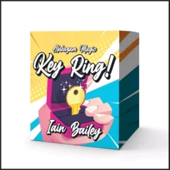 Close-up image of a magician's hands demonstrating Iain Bailey's Key Ring magic trick, showing a key visibly bent into the shape of a finger ring.