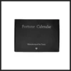 TCC Fortune Calendar magic prop by Terry Chou, a professional prediction desk calendar shown in both standard and elegant walnut finishes, demonstrating its use for mentalism effects.