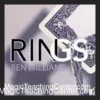 Close-up view of two signed playing card rings impossibly linked together, held by a magician's hand, demonstrating Ben Williams' RINGS magic trick.