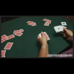 Jason England demonstrating the precise grip and motion for a Bottom Deal with a deck of playing cards, a still from his expert sleight of hand tutorial.