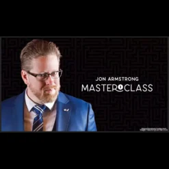 Professional magician Jon Armstrong performing a stand-up magic routine with cards on stage during his Vanishing Inc Masterclass.