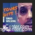 Greg Wilson demonstrating a magic trick during his Virtual Magic Conference, showcasing advanced sleight of hand and illusions in a professional setting.