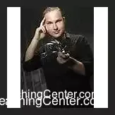 The Art of Metal Bending Ebook cover by Guy Bavli, featuring a bent fork and spoon against a dark background, illustrating the power of mentalism and magic.