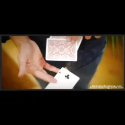 Alex Hansford demonstrating the Gödel card trick, performing an open, face-up color change where a playing card visibly transforms with a wave of his hands, showcasing the magical effect.