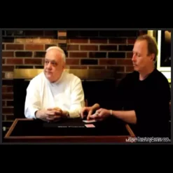 Tom Craven demonstrating the Keeper Shuffle card magic technique during his lecture video, featuring a deck of playing cards.