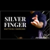 Matthieu Hamaissi performing the Silver Finger coin magic trick, showcasing a visual vanishing coin illusion with coins in his hands.