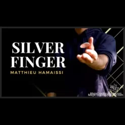Matthieu Hamaissi performing the Silver Finger coin magic trick, showcasing a visual vanishing coin illusion with coins in his hands.
