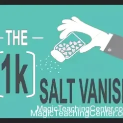 A magician's hand performing the 1k Salt Vanish, making a pile of salt disappear using the classic thumb tip technique during a close-up magic demonstration.