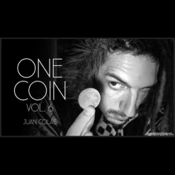 Close-up of Juan Colas's hands performing a coin vanish during the 'One Coin' magic video tutorial, demonstrating a complex sleight.