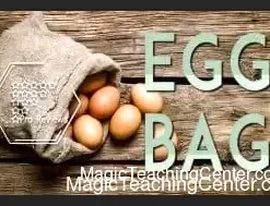 Magician demonstrating The Egg Bag classic illusion, making an egg vanish and reappear, as taught by Conjuror Community.