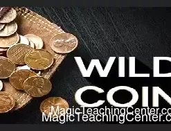 Hands performing the Wild Coin coin magic trick, demonstrating the transformation of a silver half-dollar into a copper coin, with other coins and a coffee mug visible.